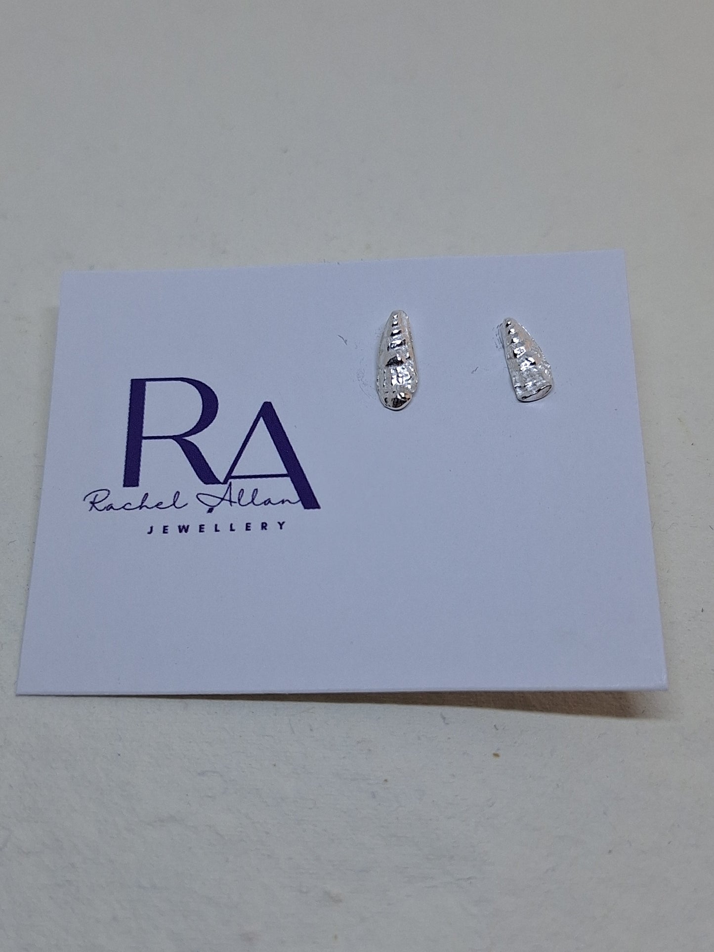 Tiny Auger shell stud earrings